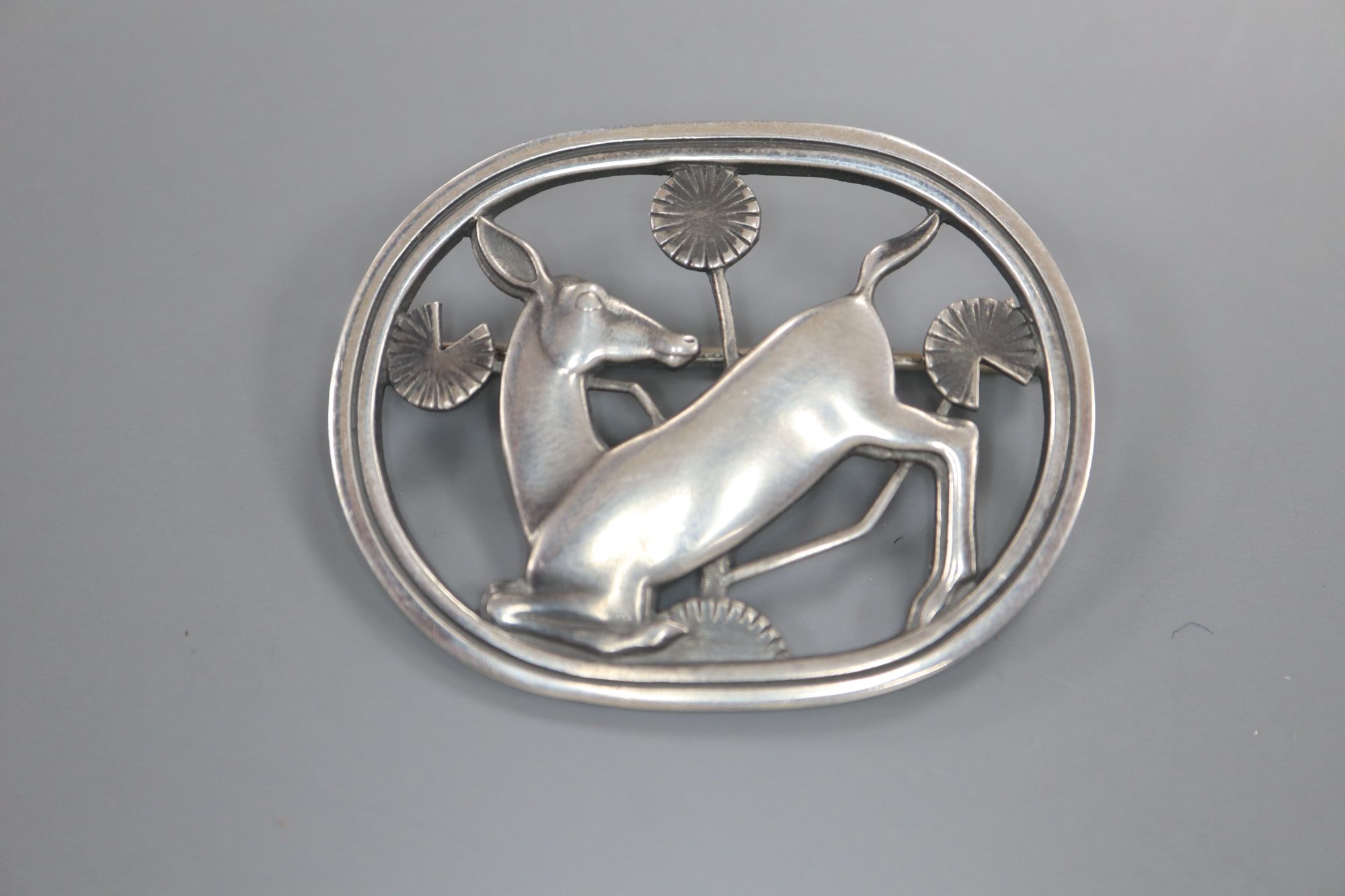 A Georg Jensen sterling Kneeling deer oval brooch, no. 256, 43mm.